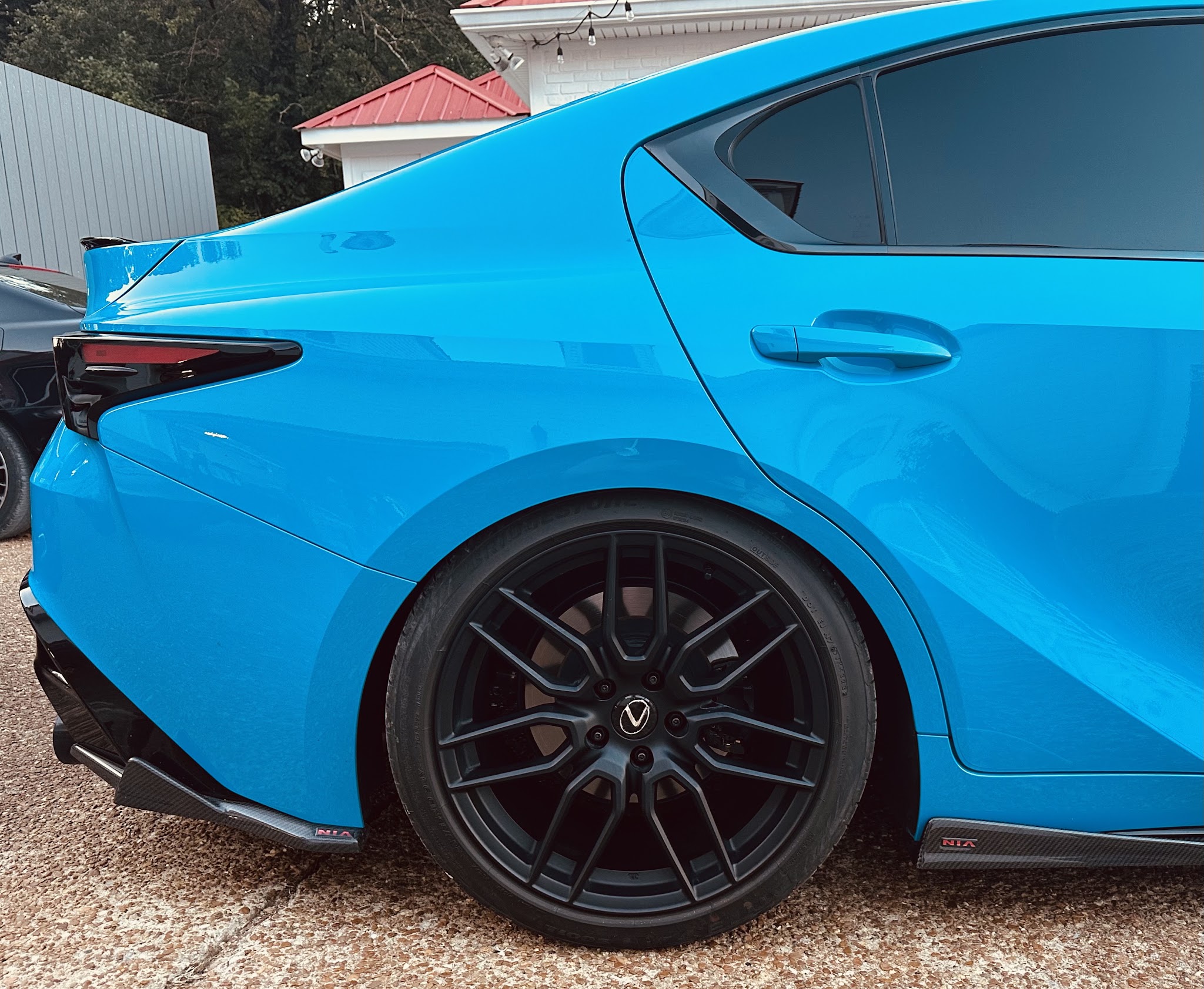 Rear quarter of a tuned 2024 Lexus IS500 with Meisterschaft valved exhaust